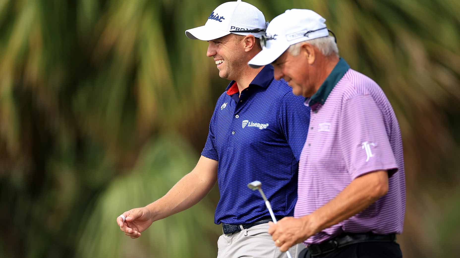 Justin and Mike Thomas walk at the pnc championship.