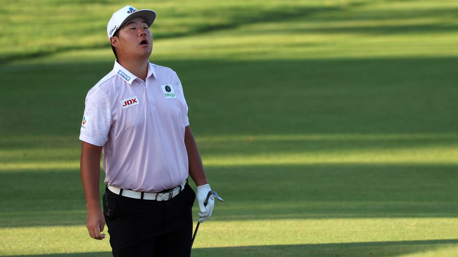 Sungjae Im of South Korea reacts to his shot out of the during the second round of the Sony Open in Hawaii at Waialae Country Club on January 13, 2023 in Honolulu, Hawaii.