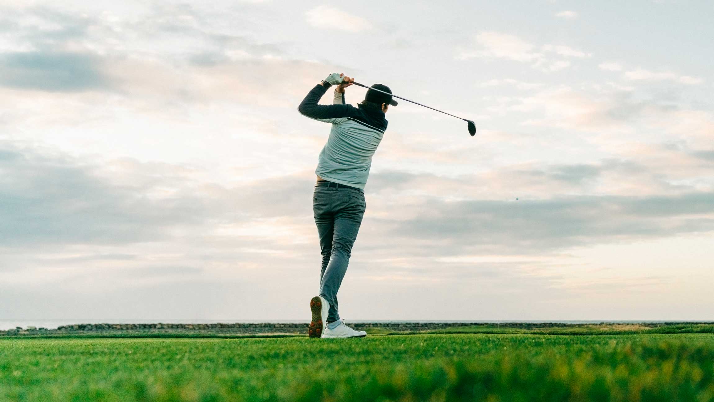 Golfer holding swing finish