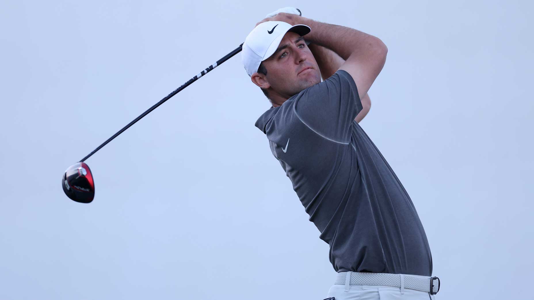 Scottie Scheffler of the United States plays his shot from the 17th tee during the third round of the WM Phoenix Open at TPC Scottsdale on February 11, 2023 in Scottsdale, Arizona.
