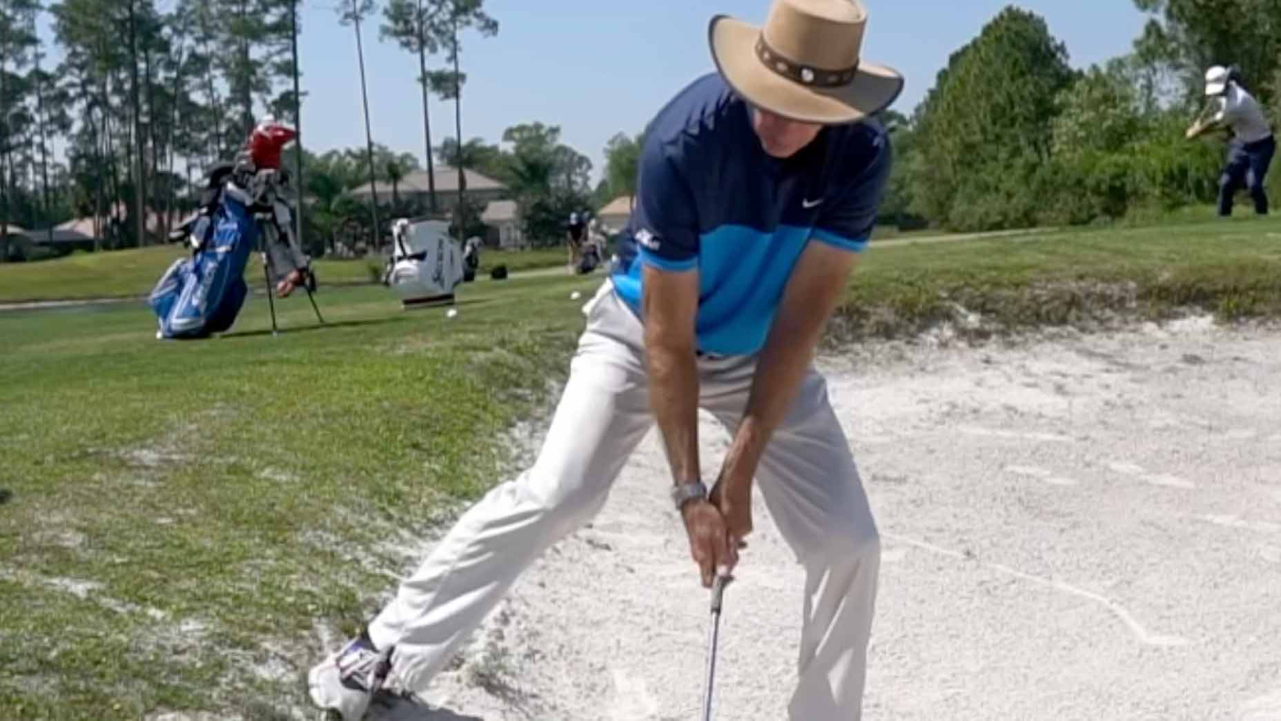 Use this technique to overcome a nasty downhill lie in a greenside bunker