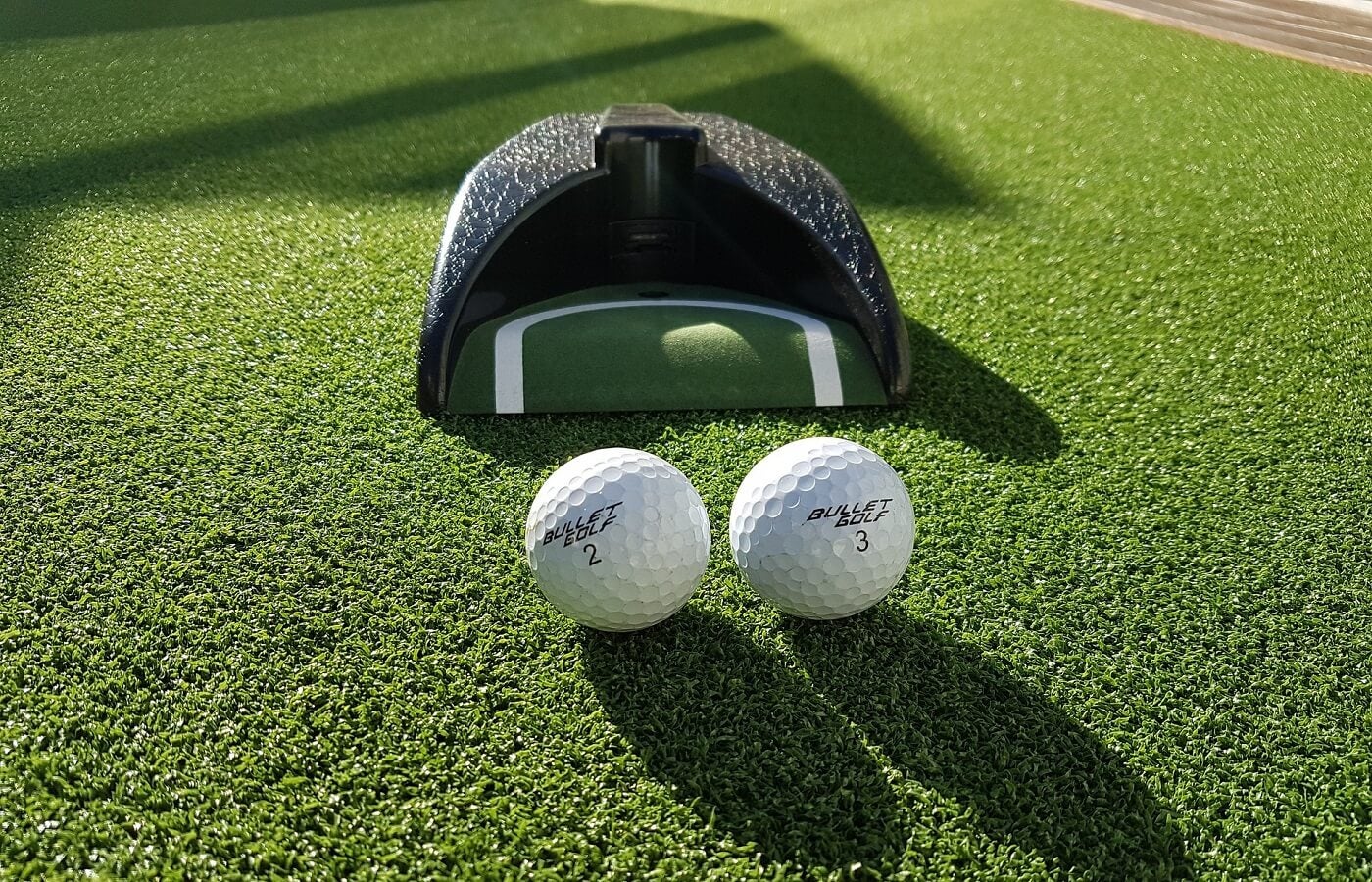 Golf balls in front of a golf gadget