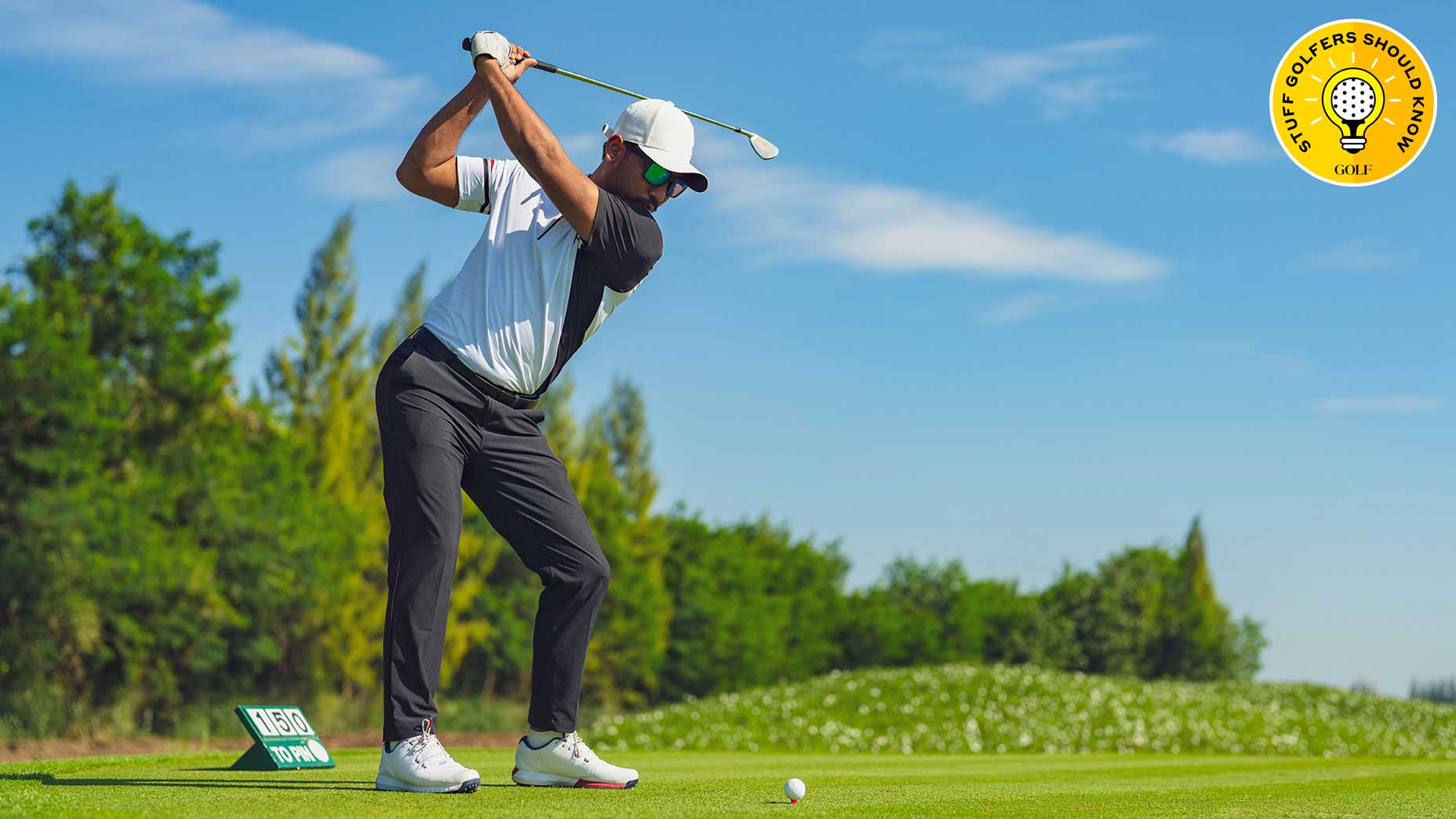 a golfer swings