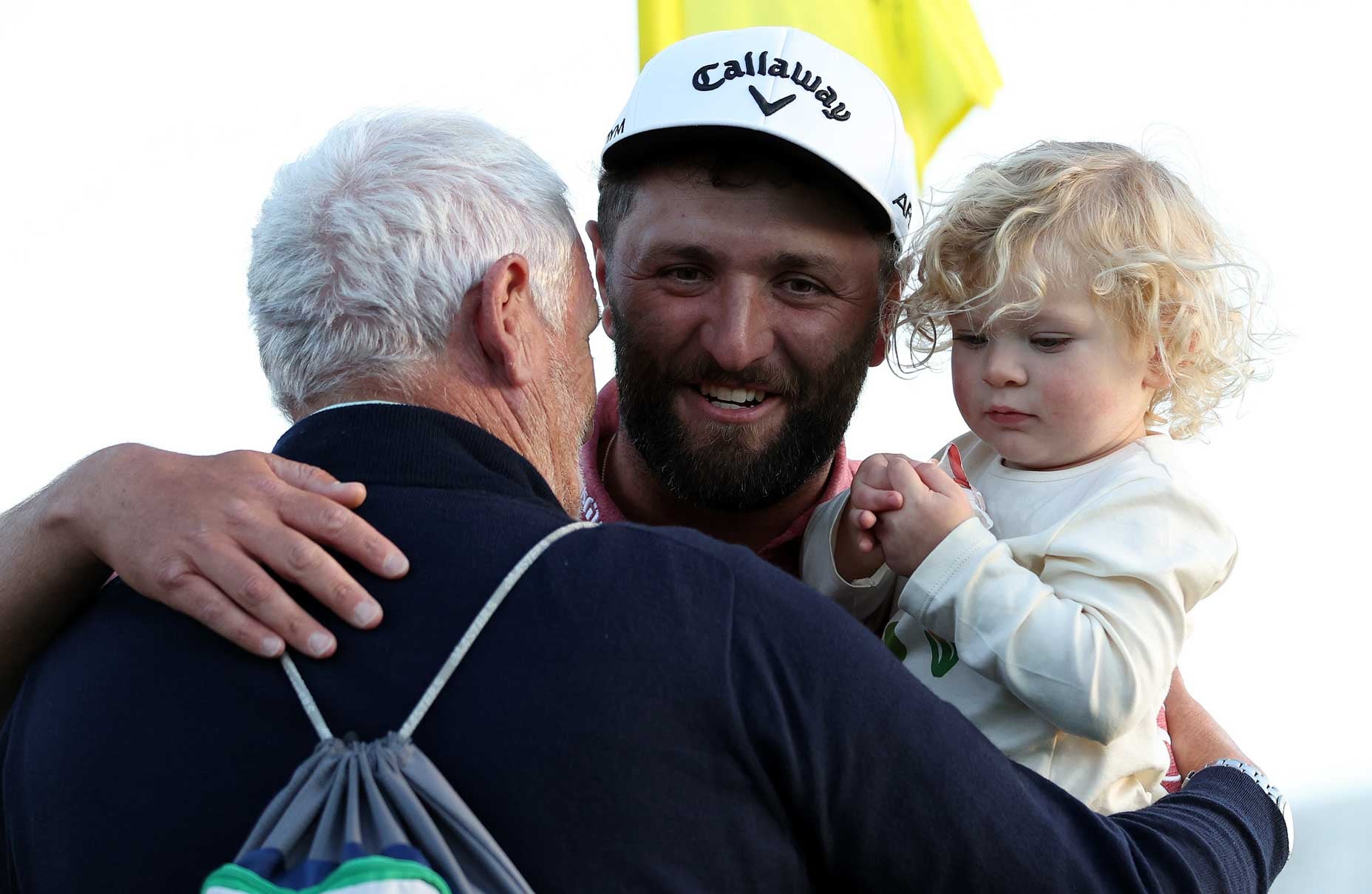 AUGUSTA, GEORGIA - APRIL 09: Jon Rahm of Spain celebrates with his son Kepa Cahill Rahm and his father, Edorta Rahm, on the 18th green after winning the 2023 Masters Tournament at Augusta National Golf Club on April 09, 2023 in Augusta, Georgia. (Photo by Patrick Smith/Getty Images)
