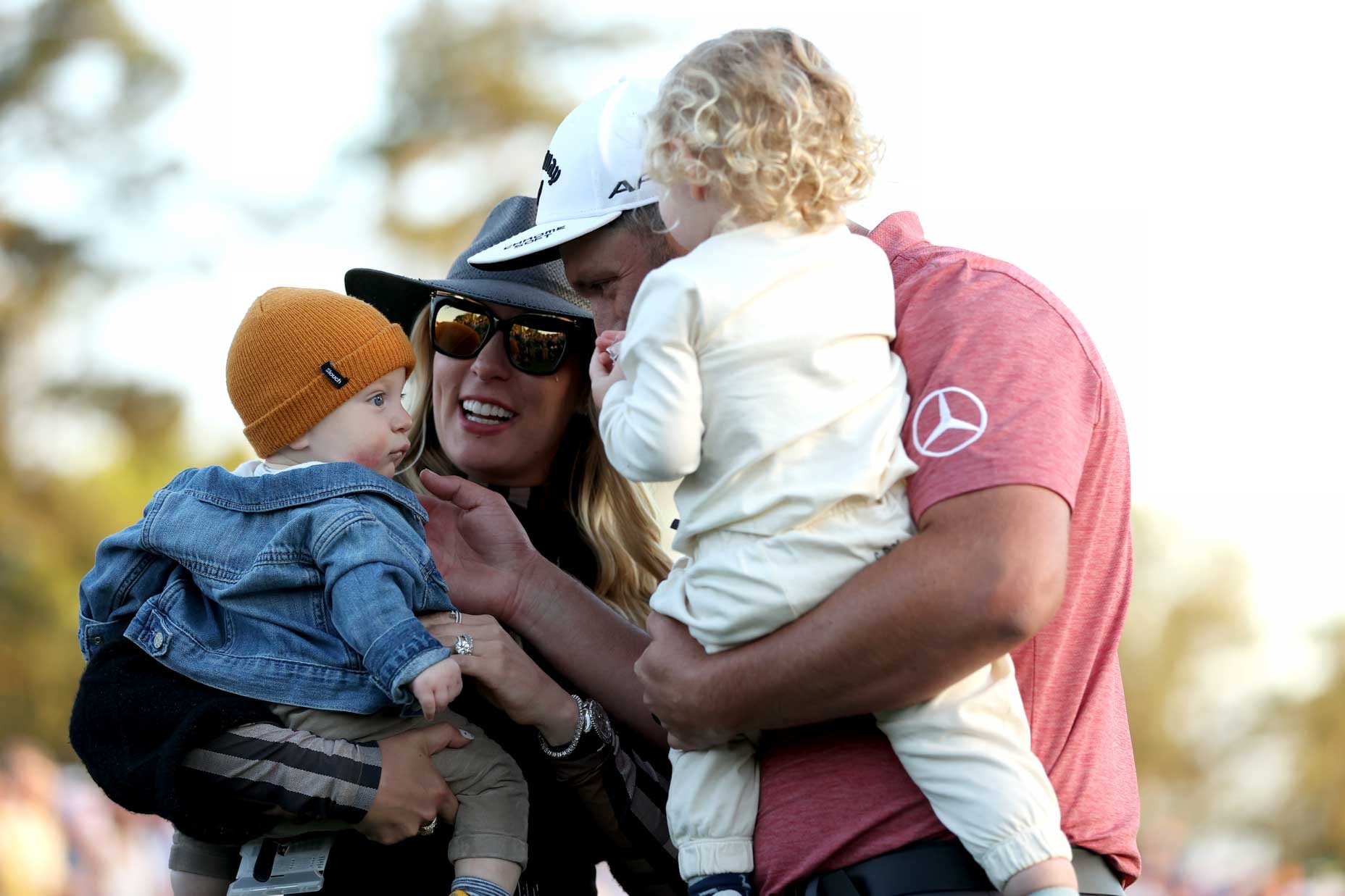 AUGUSTA, GEORGIA - APRIL 09: Jon Rahm of Spain celebrates with his sons Kepa Cahill Rahm and Eneko Cahill Rahm and his wife, Kelley, on the 18th green after winning the 2023 Masters Tournament at Augusta National Golf Club on April 09, 2023 in Augusta, Georgia. (Photo by Patrick Smith/Getty Images)