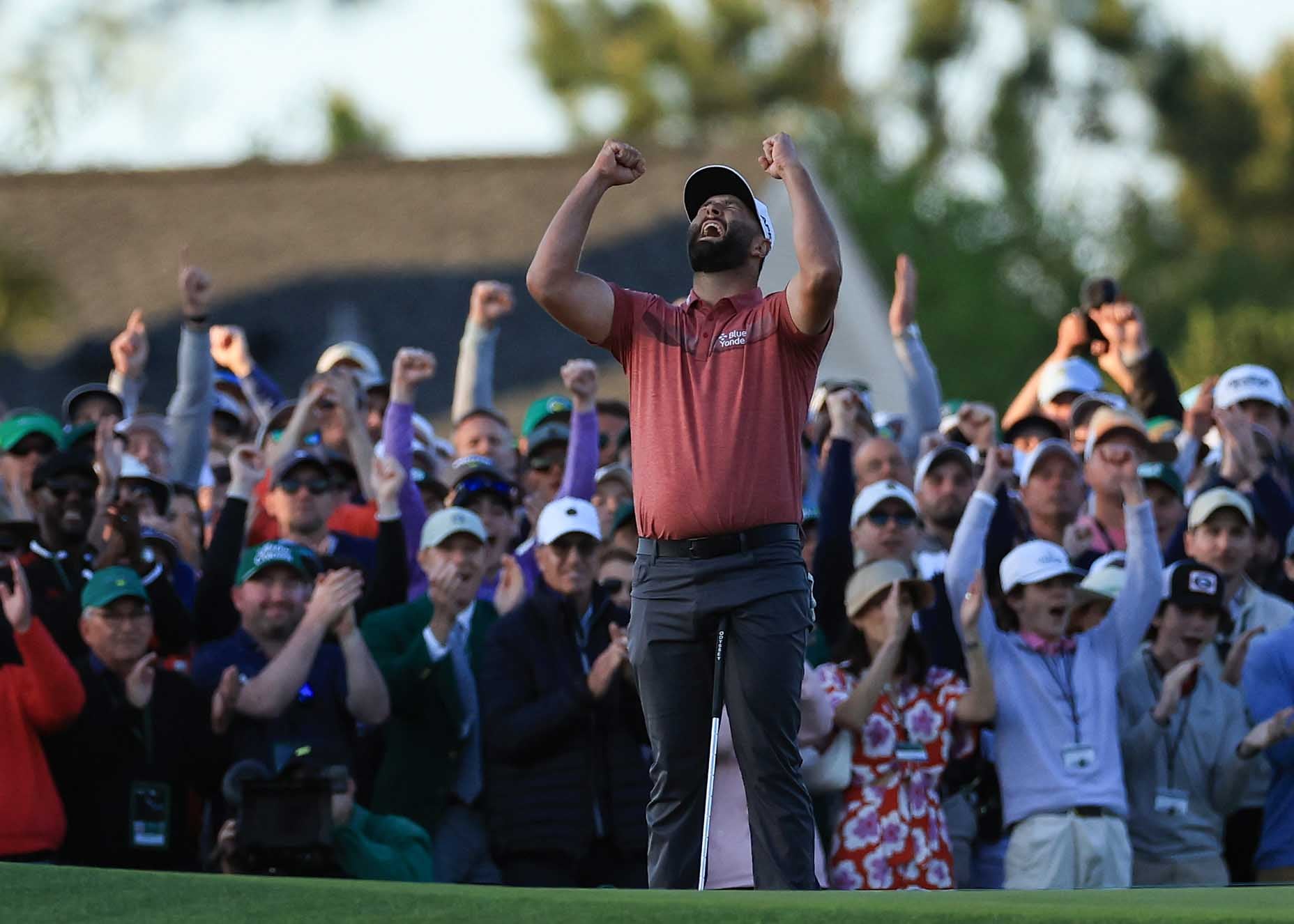 AUGUSTA, GEORGIA - APRIL 09: Jon Rahm of Spain celebrates holing the winning putt on the 18th green during the final round of the 2023 Masters Tournament at Augusta National Golf Club on April 09, 2023 in Augusta, Georgia. (Photo by David Cannon/Getty Images)