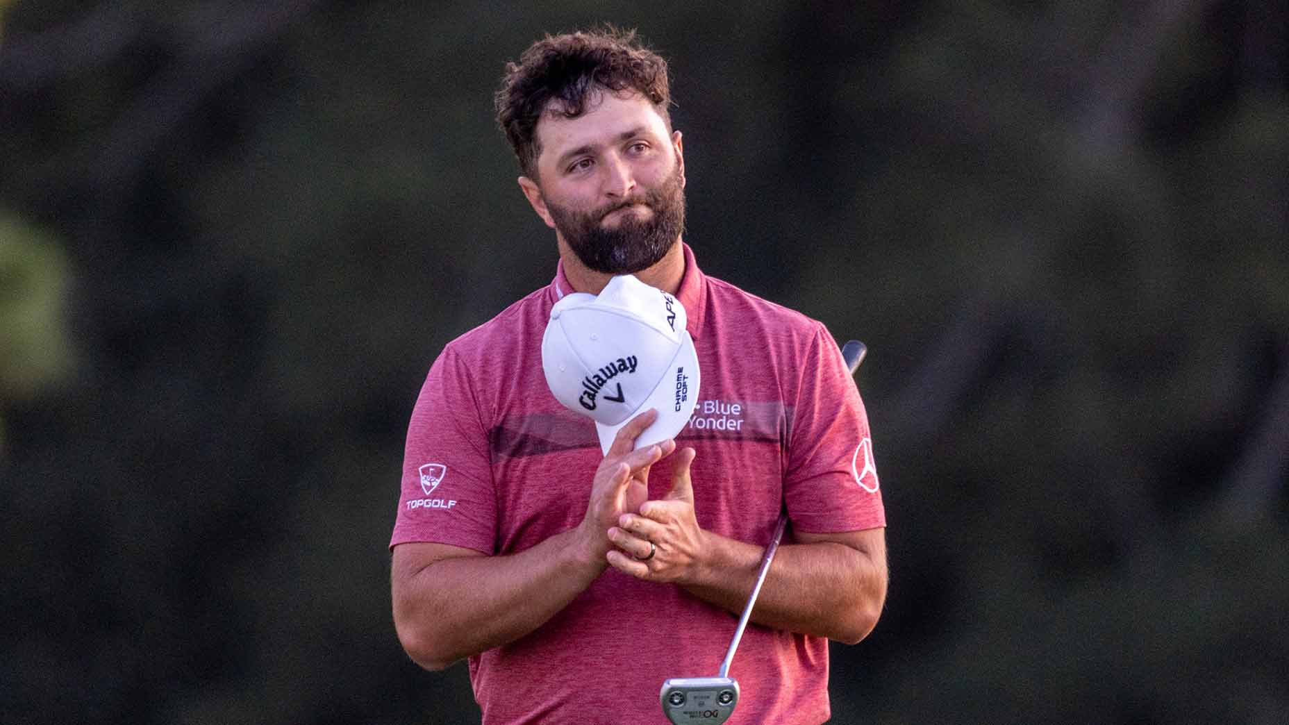 jon rahm holds hat masters