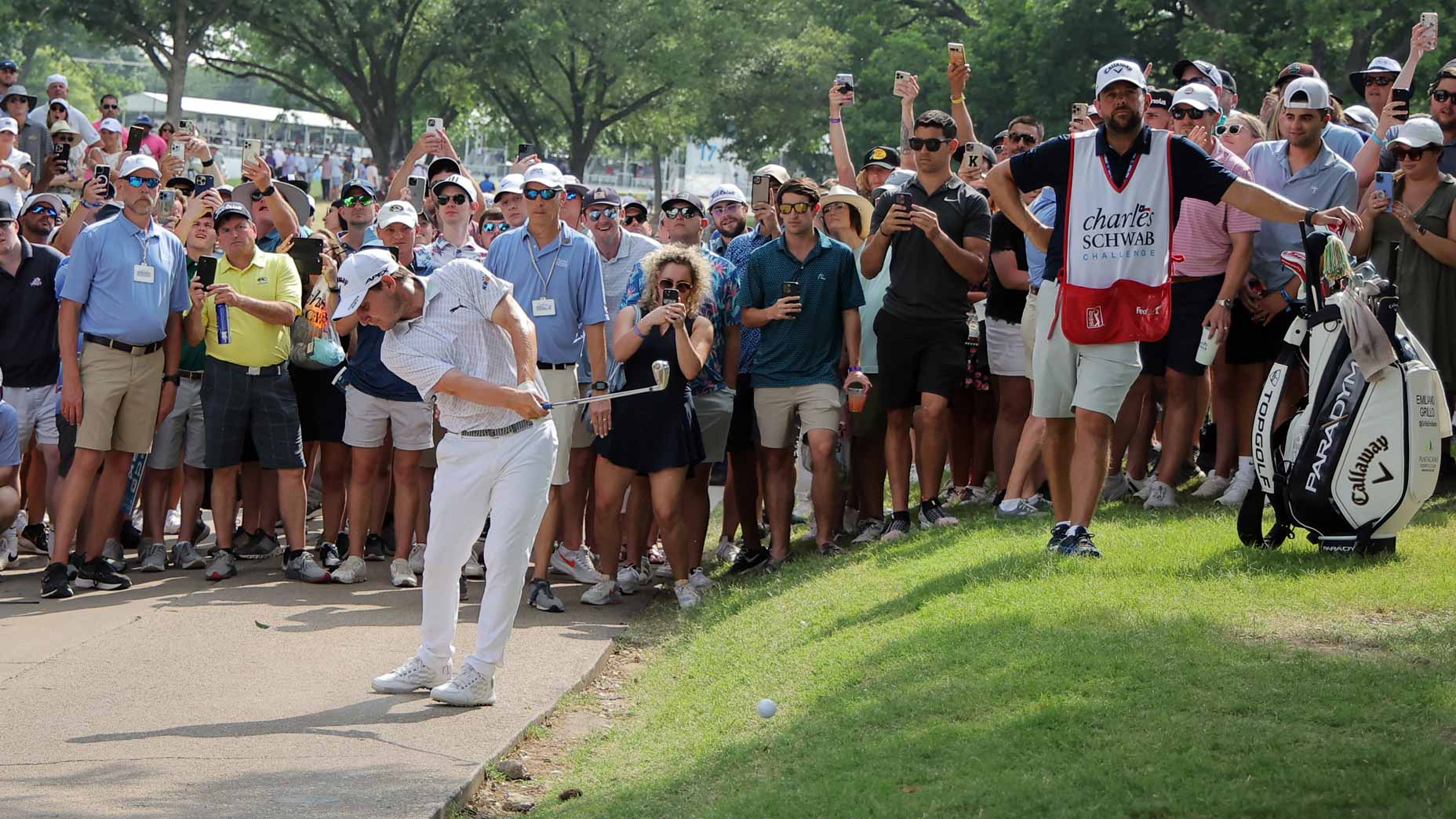 Emiliano Grillo of Argentina hits shot on the 18th hole from the cartpath during the final round of the Charles Schwab Challenge at Colonial Country Club on May 28, 2023 in Fort Worth, Texas.