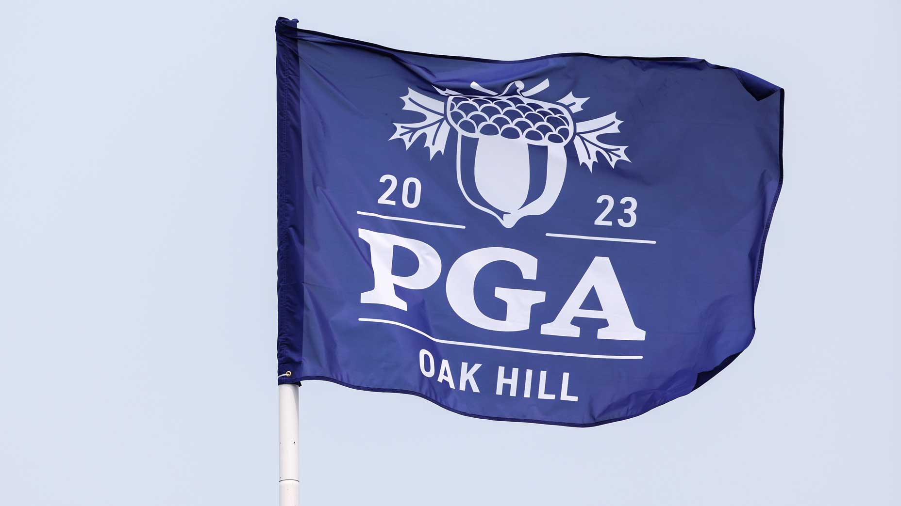 A PGA flag blows in the breeze during a practice round prior to the 2023 PGA Championship at Oak Hill Country Club on May 16, 2023 in Rochester, New York.