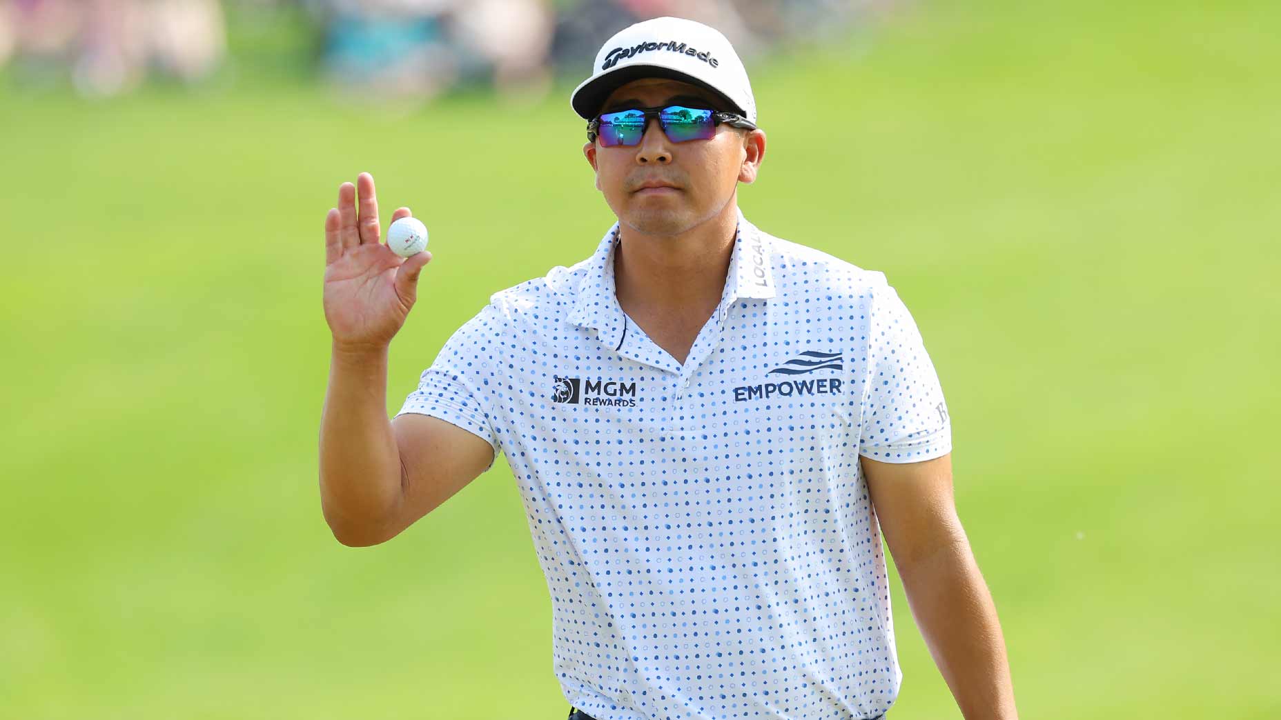 Kurt Kitayam waves to fans at 2023 PGA Championship