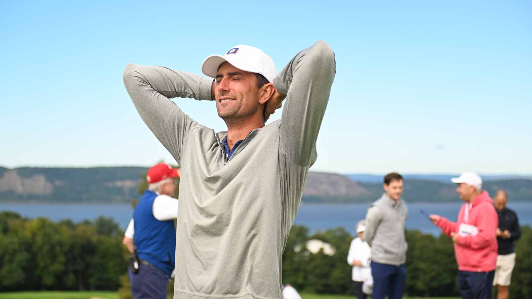 stewart hagestad holds hands on head