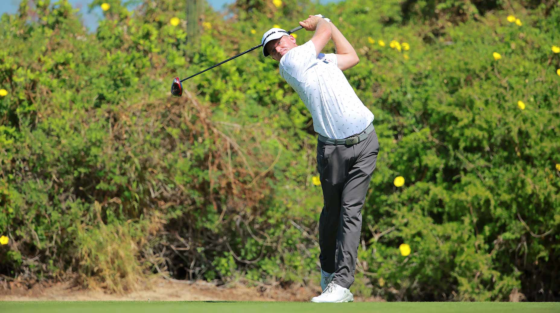adam long hits a tee shot at the world wide technology championship