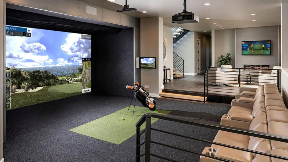 Luxury at-home Full Swing golf simulator scene with a 16 ft screen and projector from thhe ceiling.