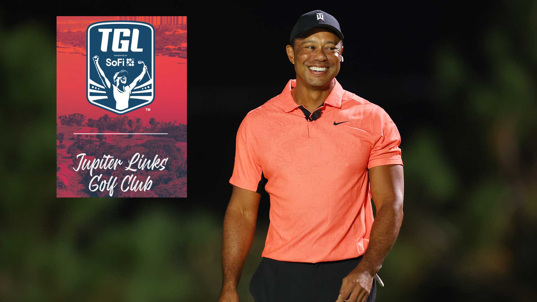 tiger woods smiles on the golf course