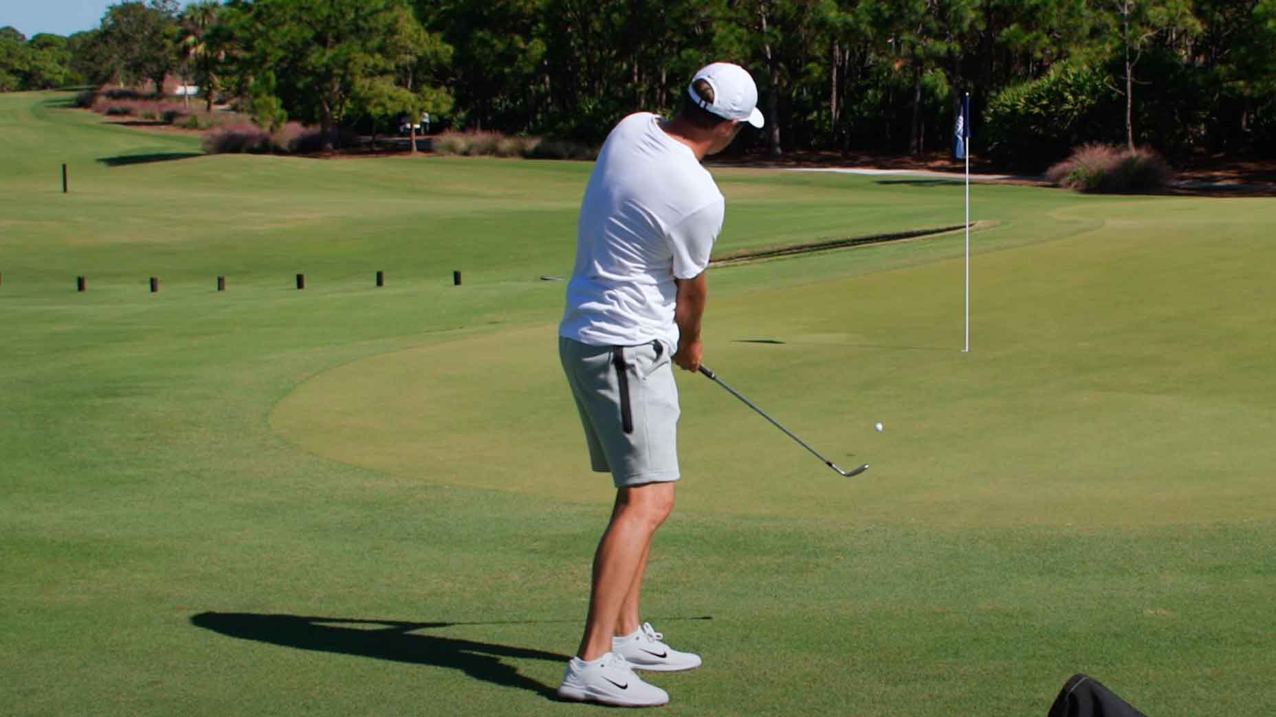World No. 1-ranked golfer Scottie Scheffler demonstrates how he attacks a downhill chip shot, helping other players improve their short game