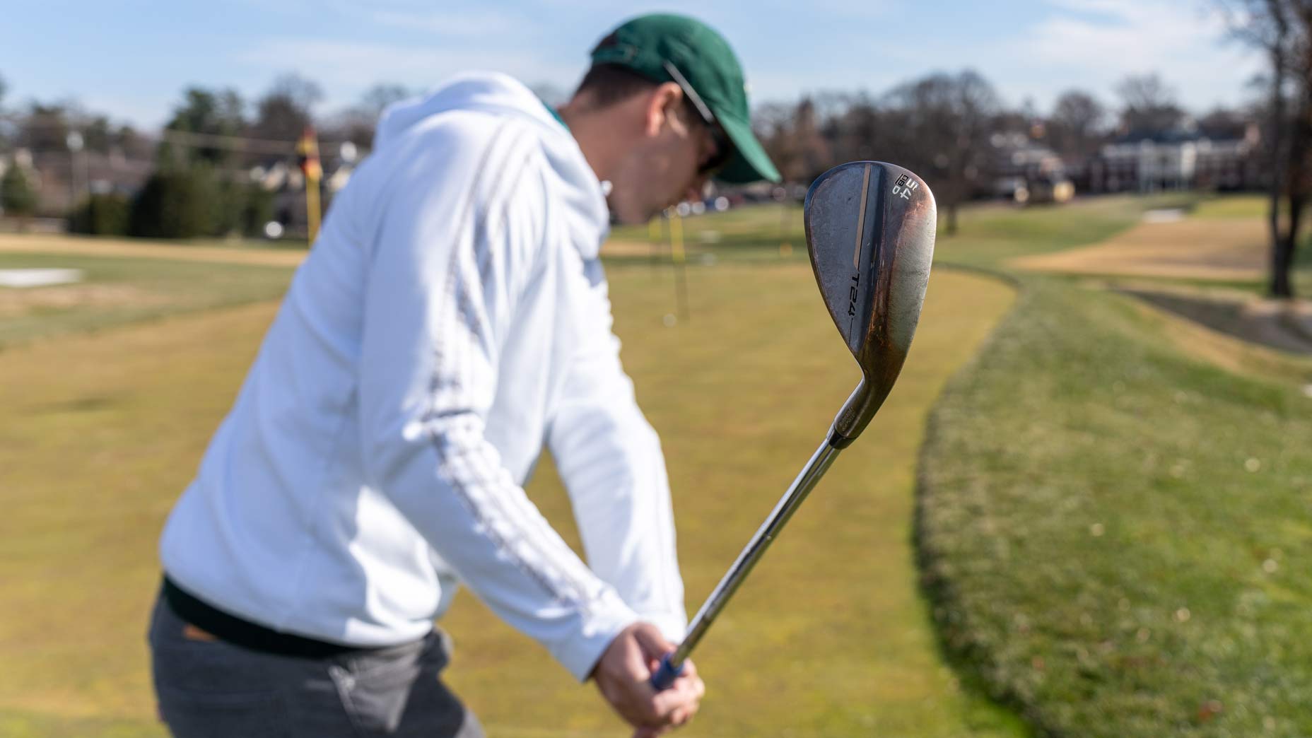 Jack Hirsh swings a Mizuno T24 wedge.