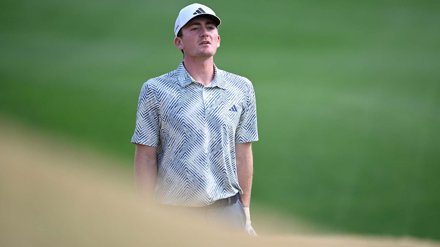 Nick Dunlap looks down the fairway at the American Express.