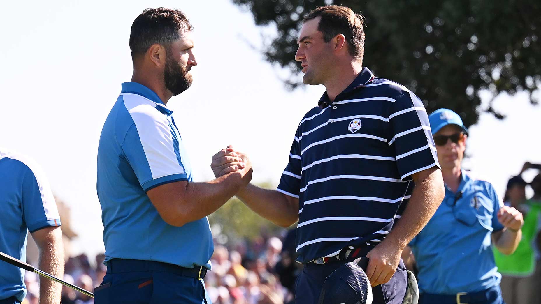 Jon Rahm and Scottie Scheffler shake hands at the Ryder Cup.