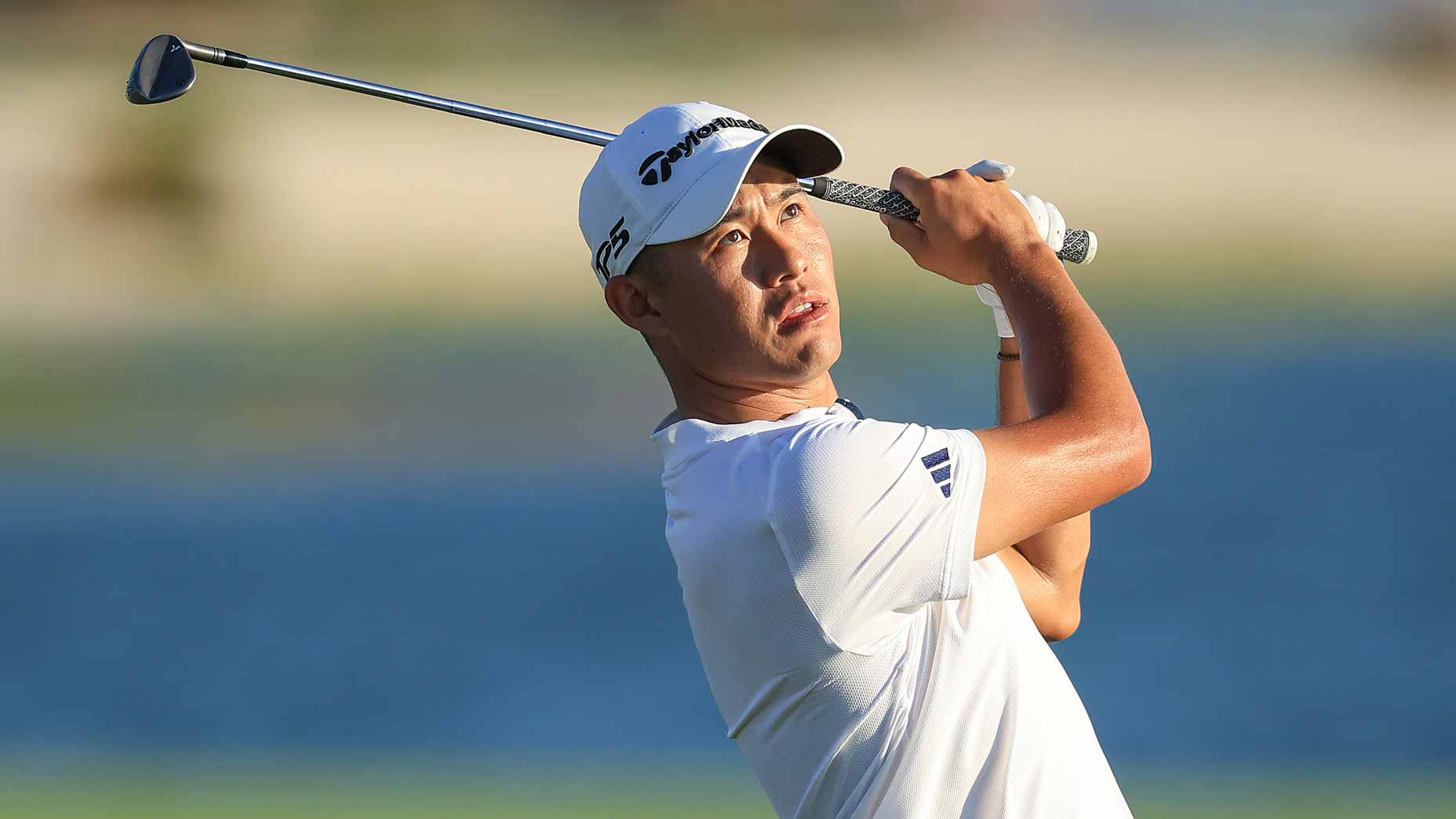 Collin Morikawa hits iron shot at2023 Hero World Challenge