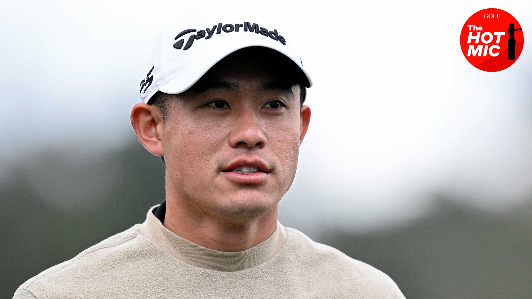 collin morikawa stares in beige shirt and white hat at AT&T Pebble Beach Pro Am