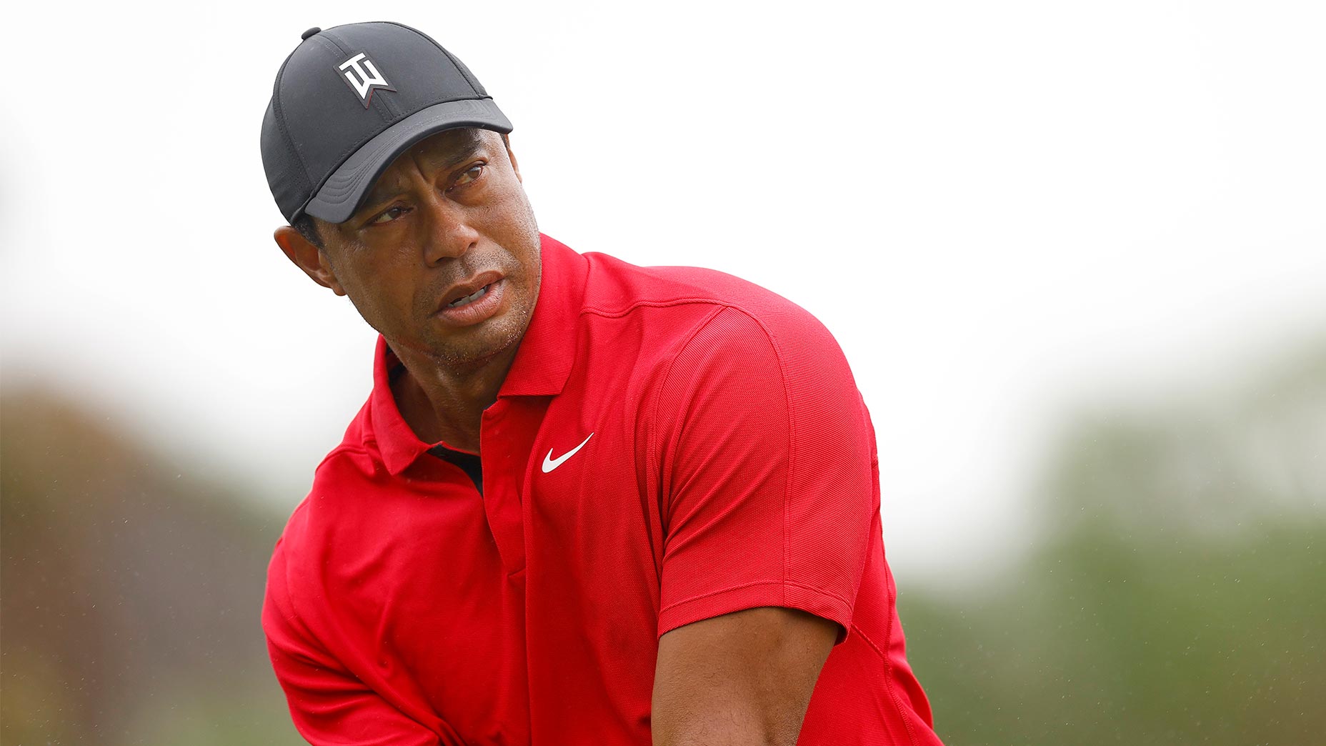 tiger woods wearing sunday red attire hits shot at pnc championship