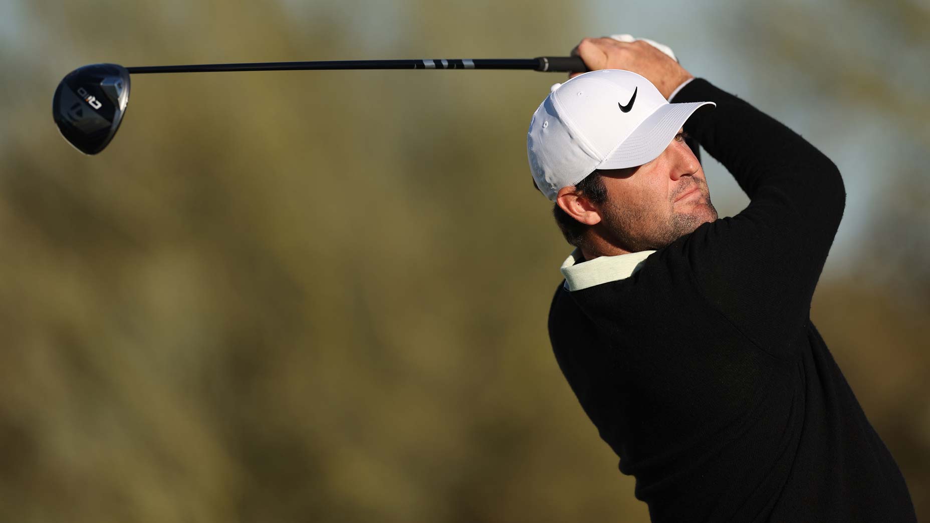 Scottie Scheffler hits a drive at TPC Scottsdale.