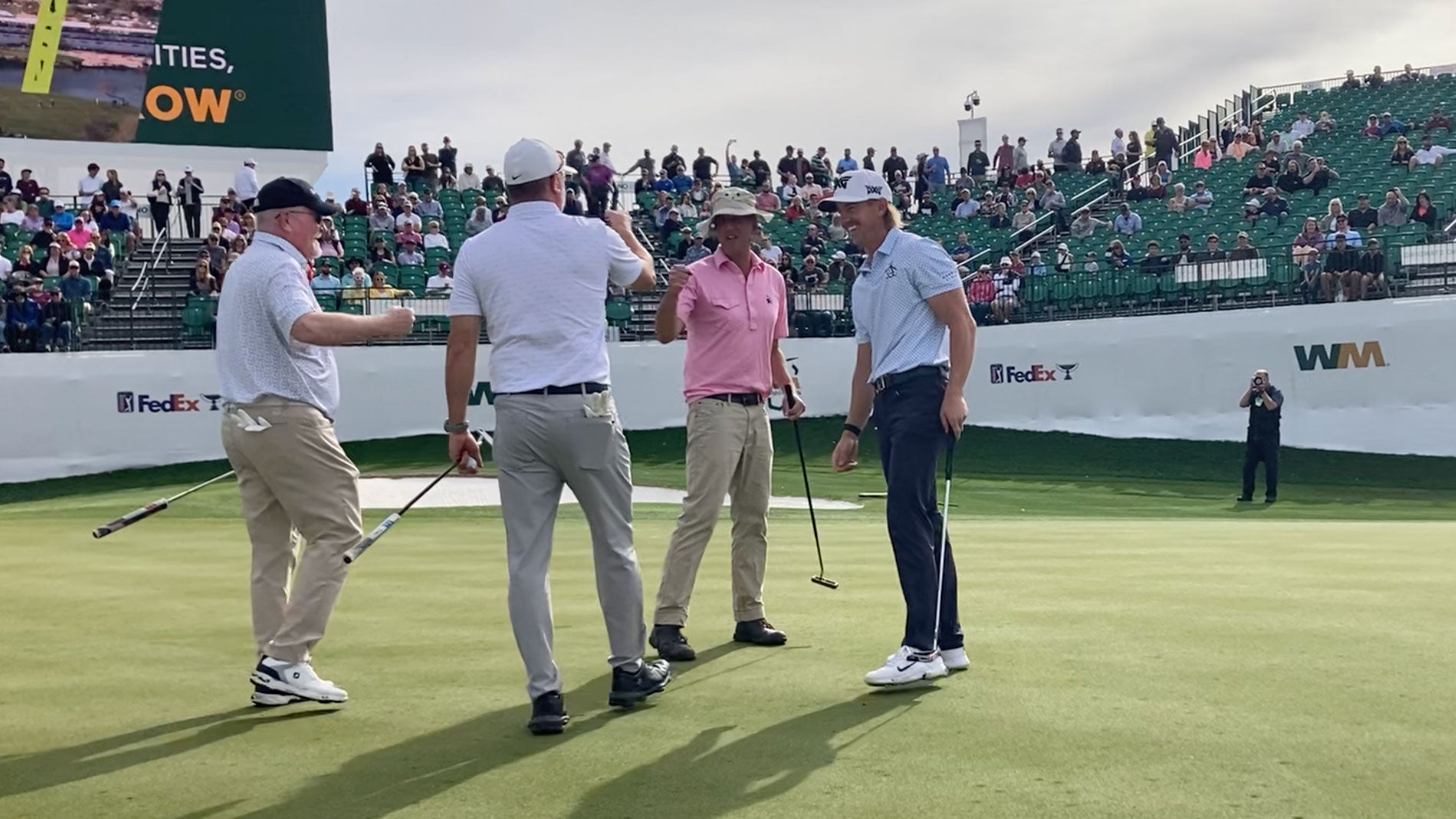 michael bamberger and his playing partners on 16th at wm phoenix open pro-am