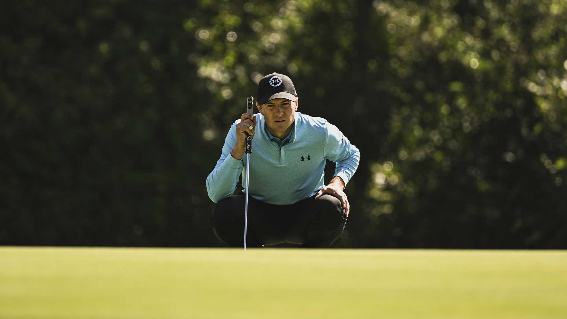 jordan spieth stares down putt at the genesis invitational in blue shirt