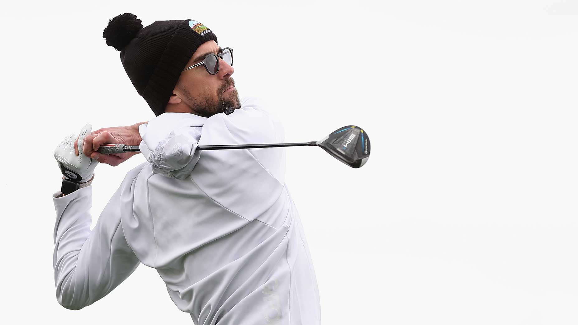 Michael Phelps watches a tee shot during the WM Phoenix Open pro-am at TPC Scottsdale on Feb. 7, 2024.
