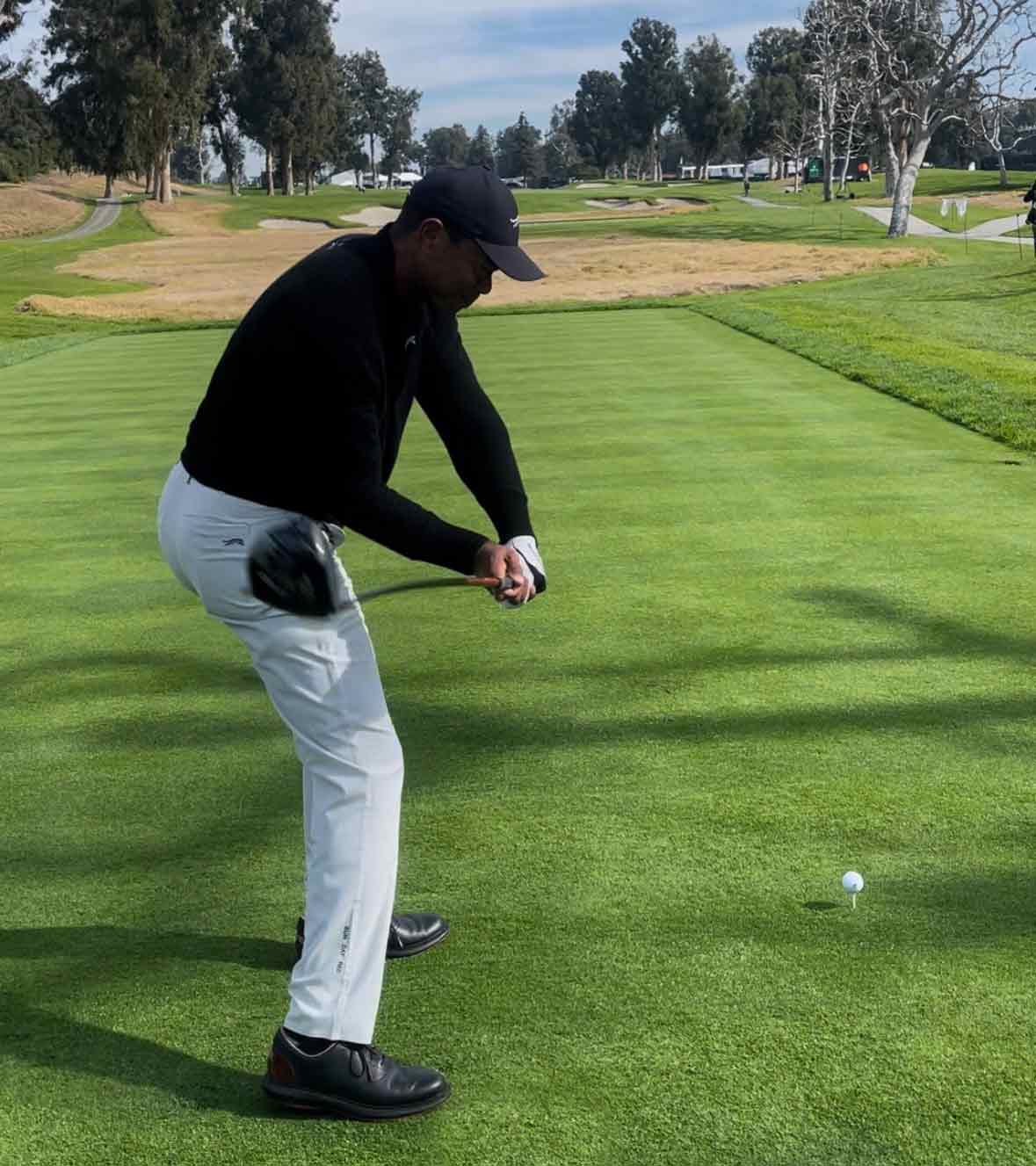 tiger woods swings during the 2024 genesis invitational