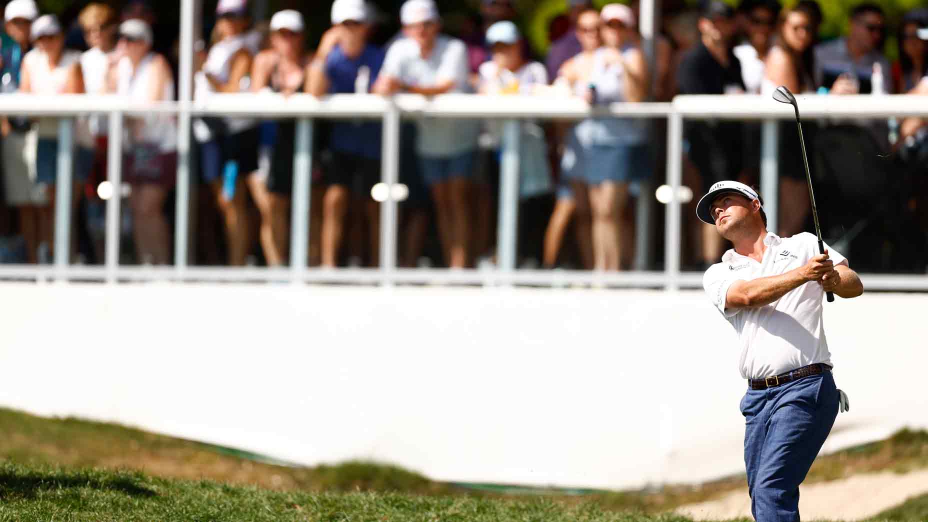 Keith Mitchell of the United States chips on the 13th green during the third round of the Valspar Championship at Copperhead Course at Innisbrook Resort and Golf Club on March 23, 2024 in Palm Harbor, Florida.