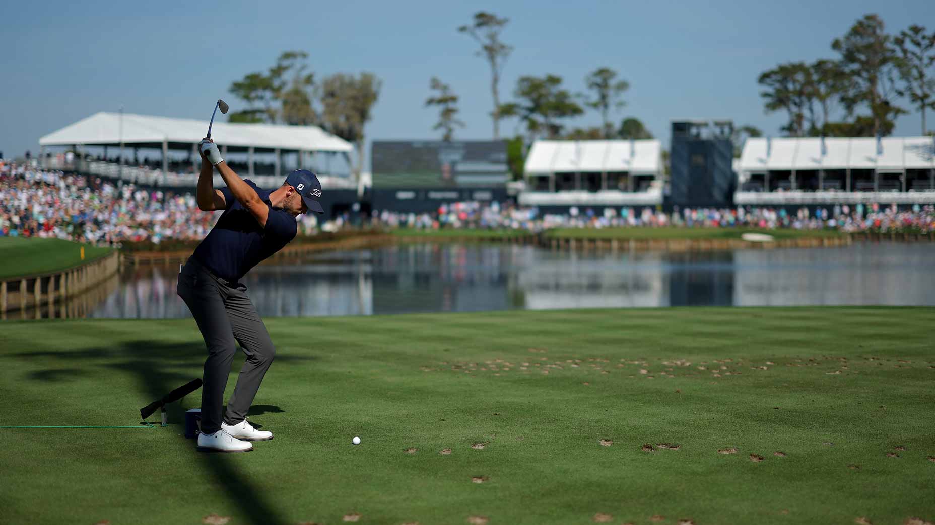 Wyndham Clark hits an approach to TPC Sawgrass' 17th.