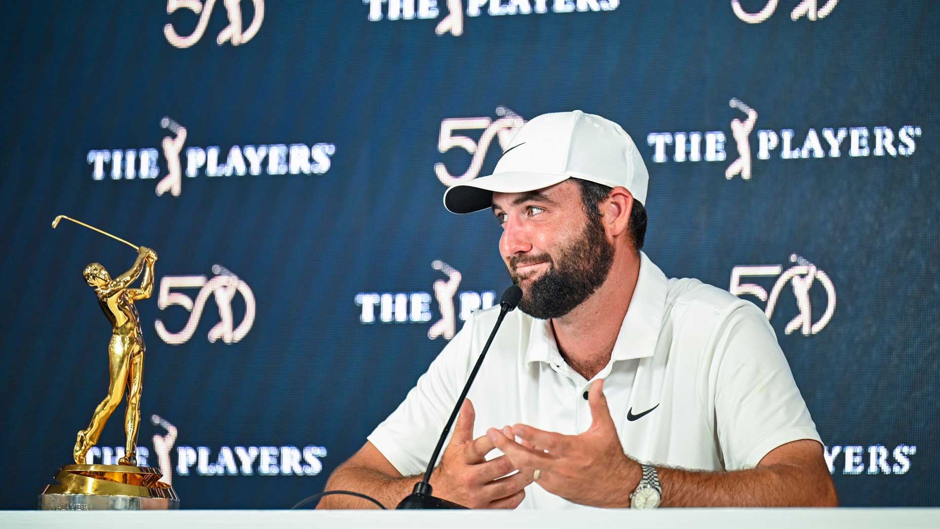 Scottie Scheffler smiles with the Players trophy.