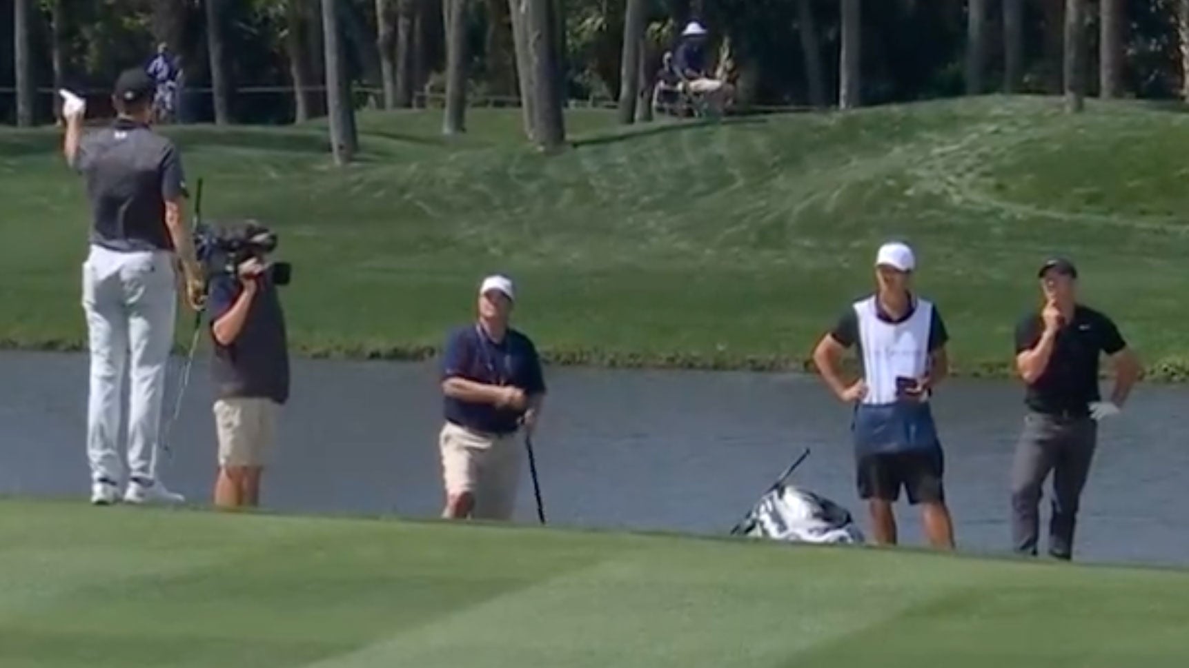 jordan spieth and rory mcilory discussing drop on 7th hole at players