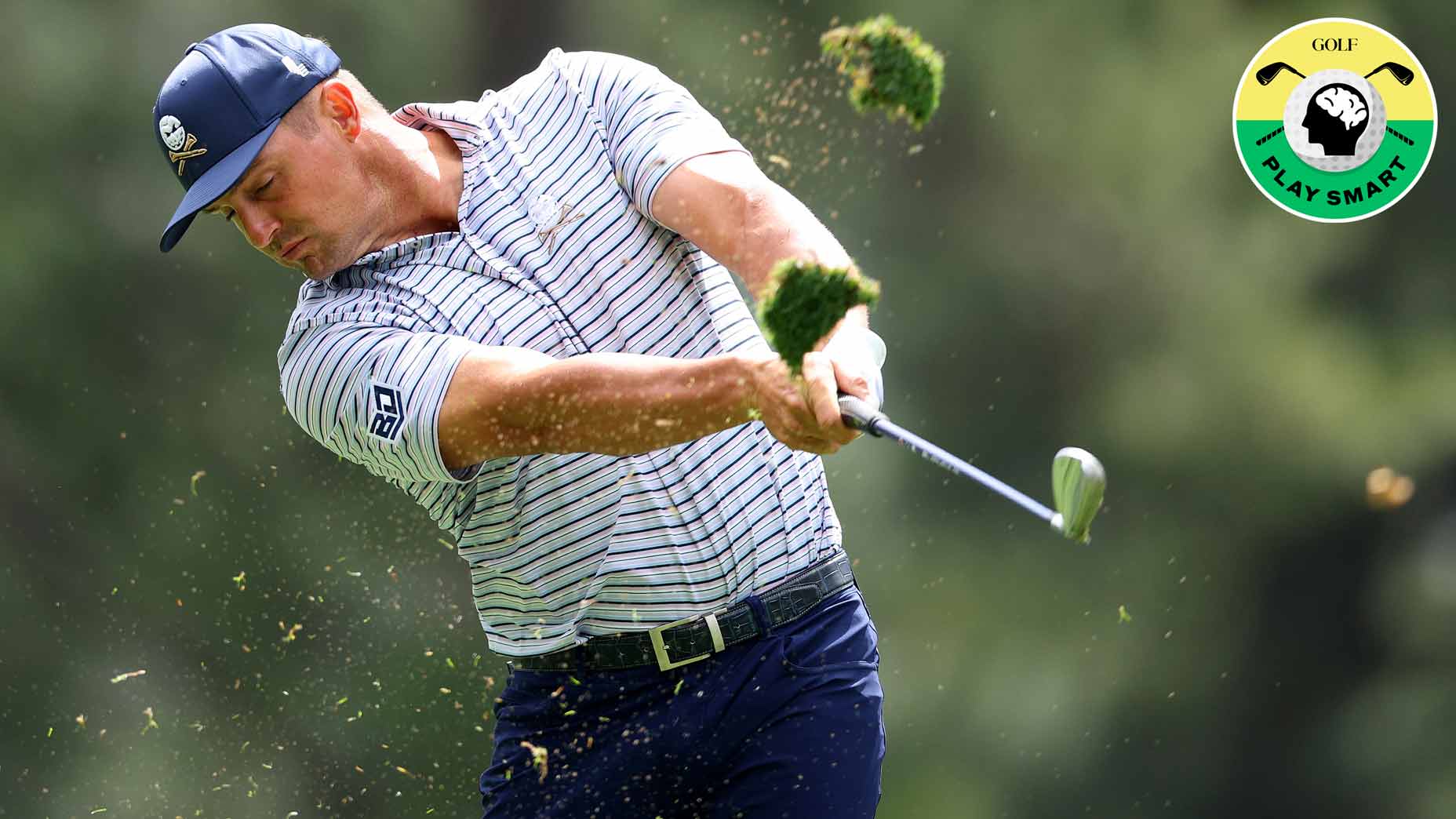 bryson dechambeau hits an iron during the first round of the 2024 masters while a divot splashes up in front of him