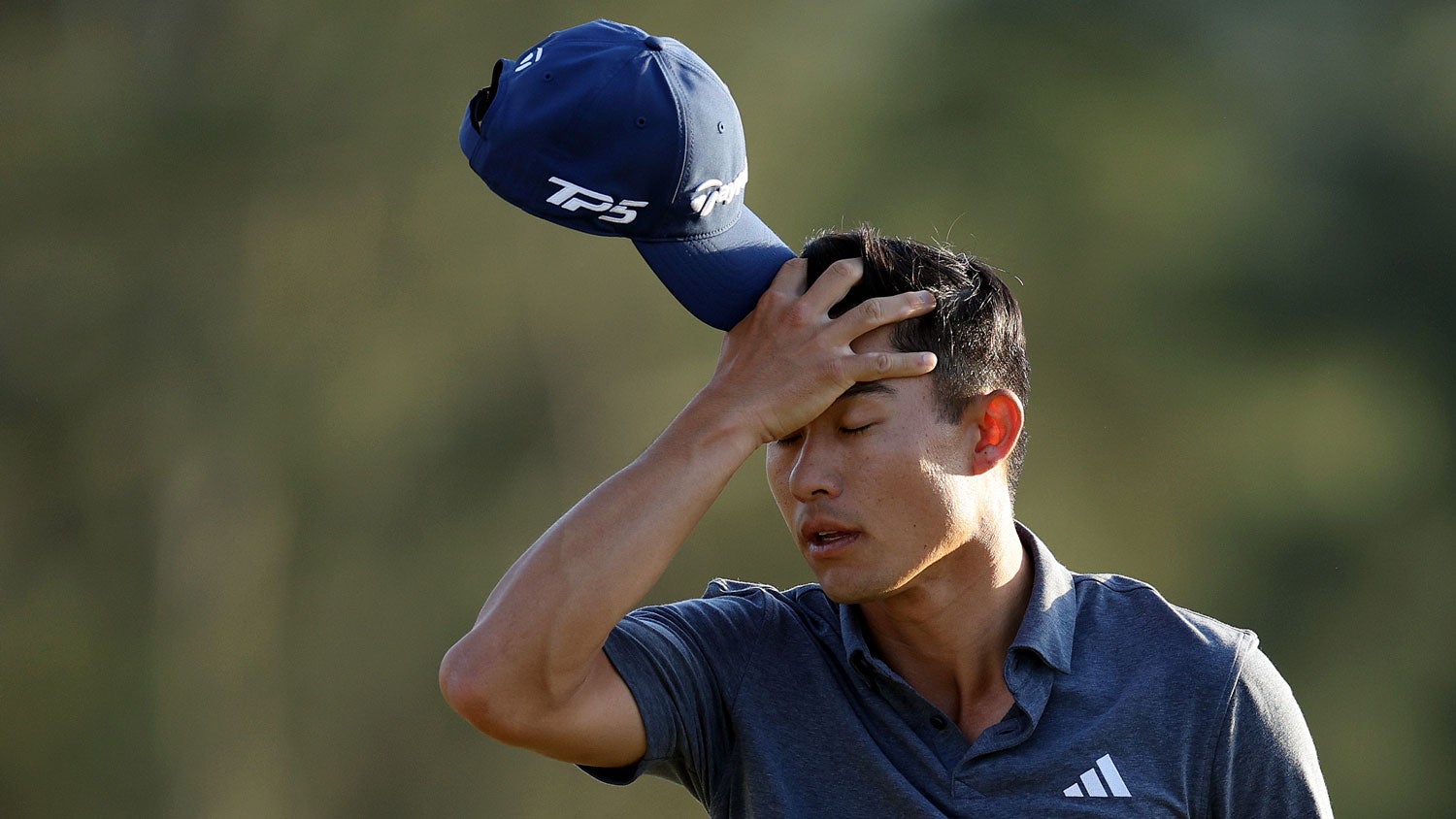 Collin Morikawa of the United States walks off the 18th green after finishing his round during the final round of the 2024 Masters Tournament at Augusta National Golf Club