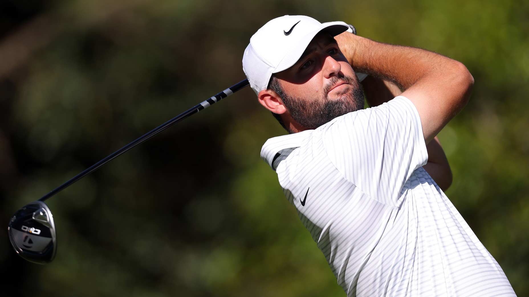 Scottie Scheffler hits drive during 2024 Masters at Augusta National