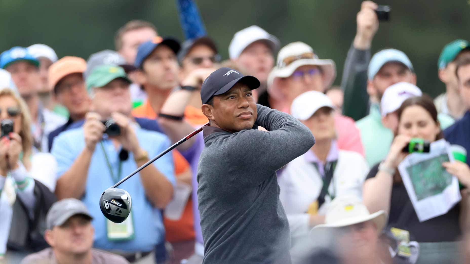 Tiger Woods hits shot during practice round at 2024 Masters