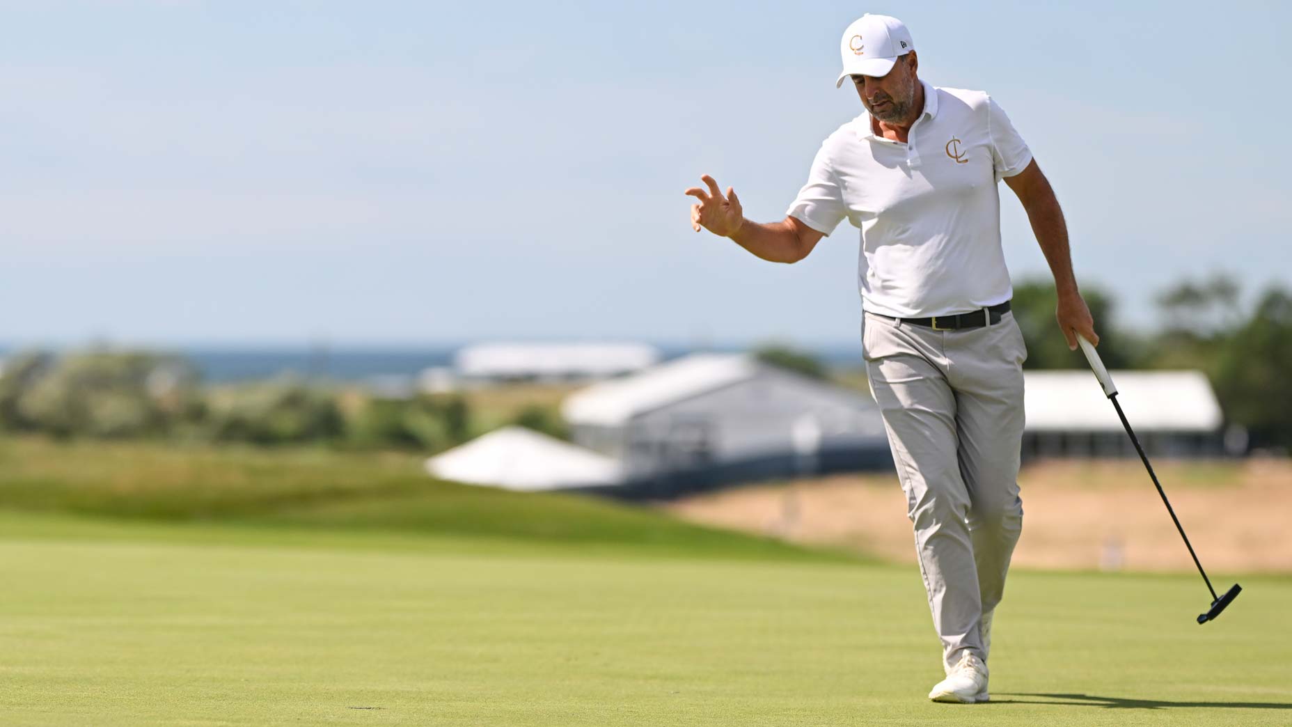 Richard Bland reacts to making a putt.