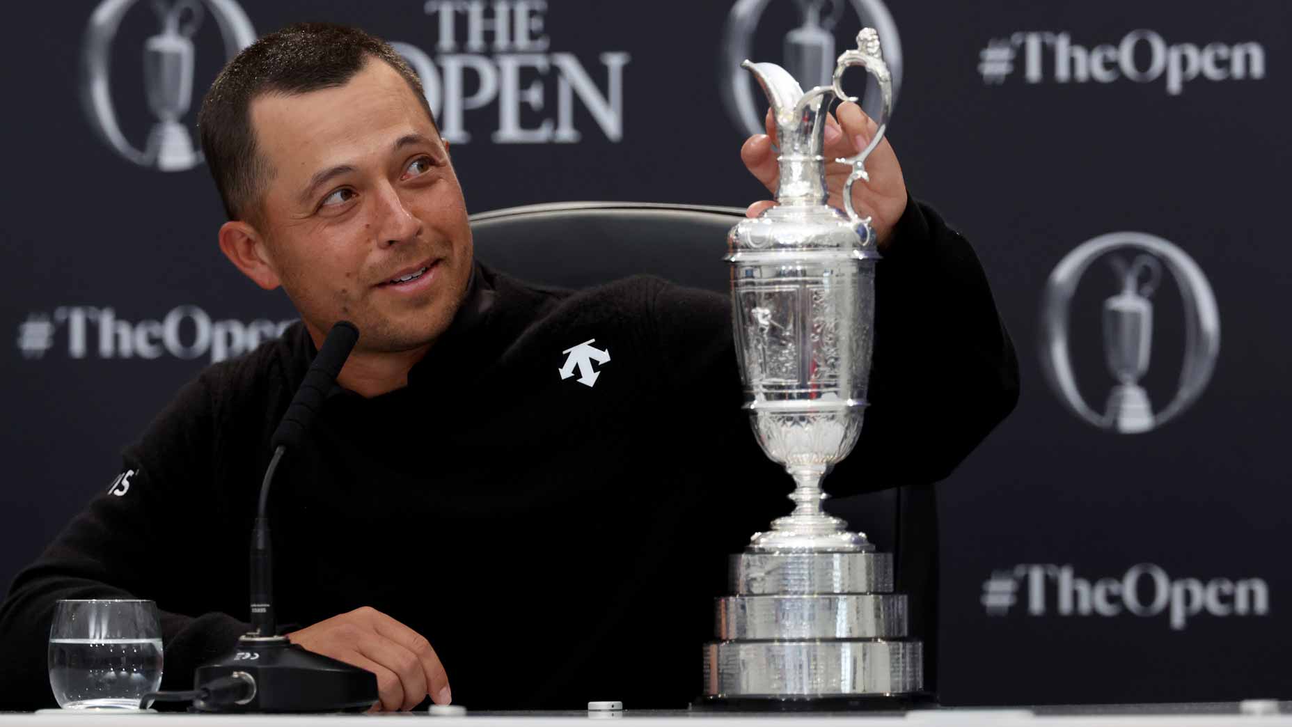 Xander Schauffele looks at the Claret Jug.