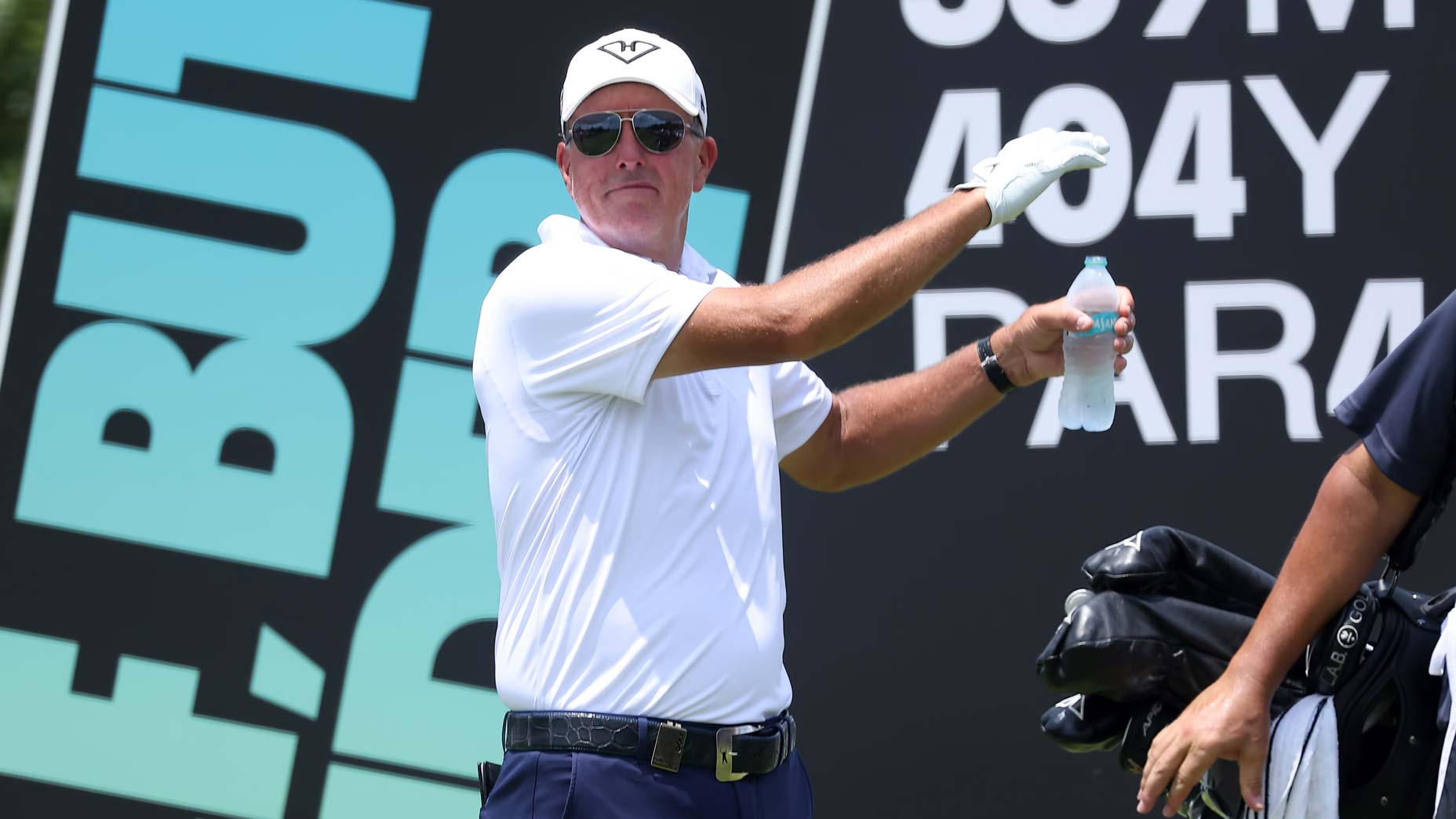 Phil Mickelson readies to hit drive at 2024 LIV tournament