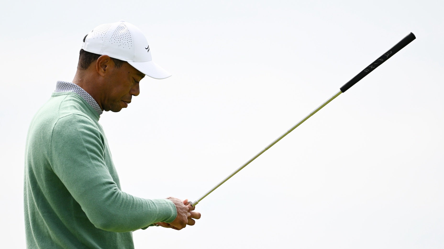 tiger woods pictured holding golf club at 2024 open championship
