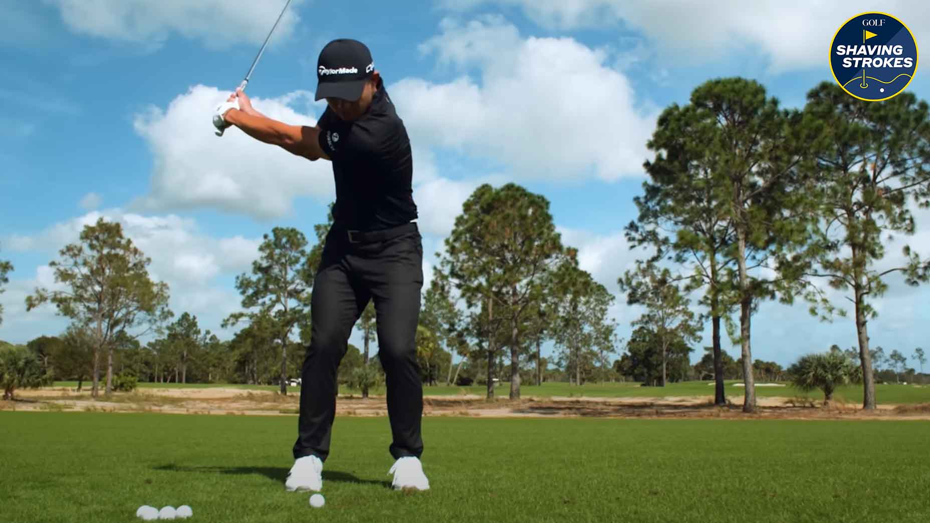 Collin Morikawa hits wedge shot on golf course