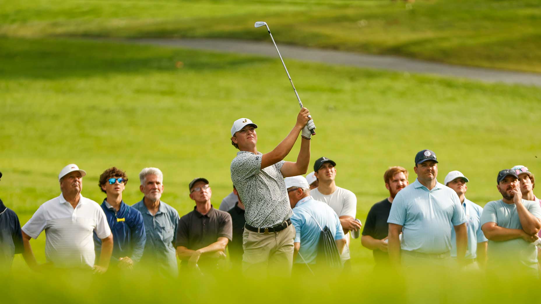 Noah Kent plays his second shot on the 14th hole during the quarterfinals of the 2024 U.S. Amateur at Hazeltine National Golf Club in Chaska, Minn. on Friday, Aug. 16, 2024.