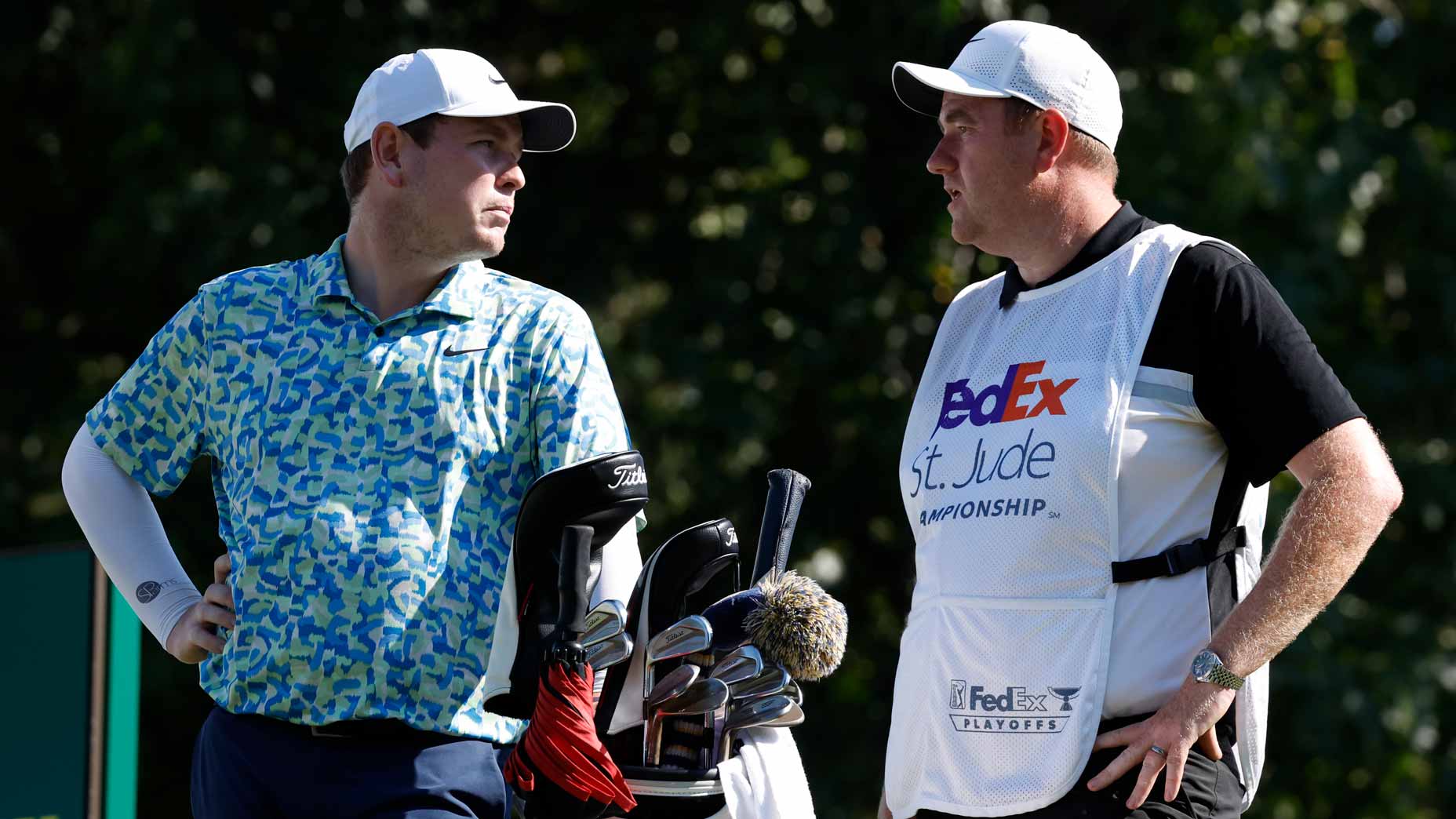 Pro golfer Robert MacIntyre talks with caddie at 2024 FedEx St. Jude Championship