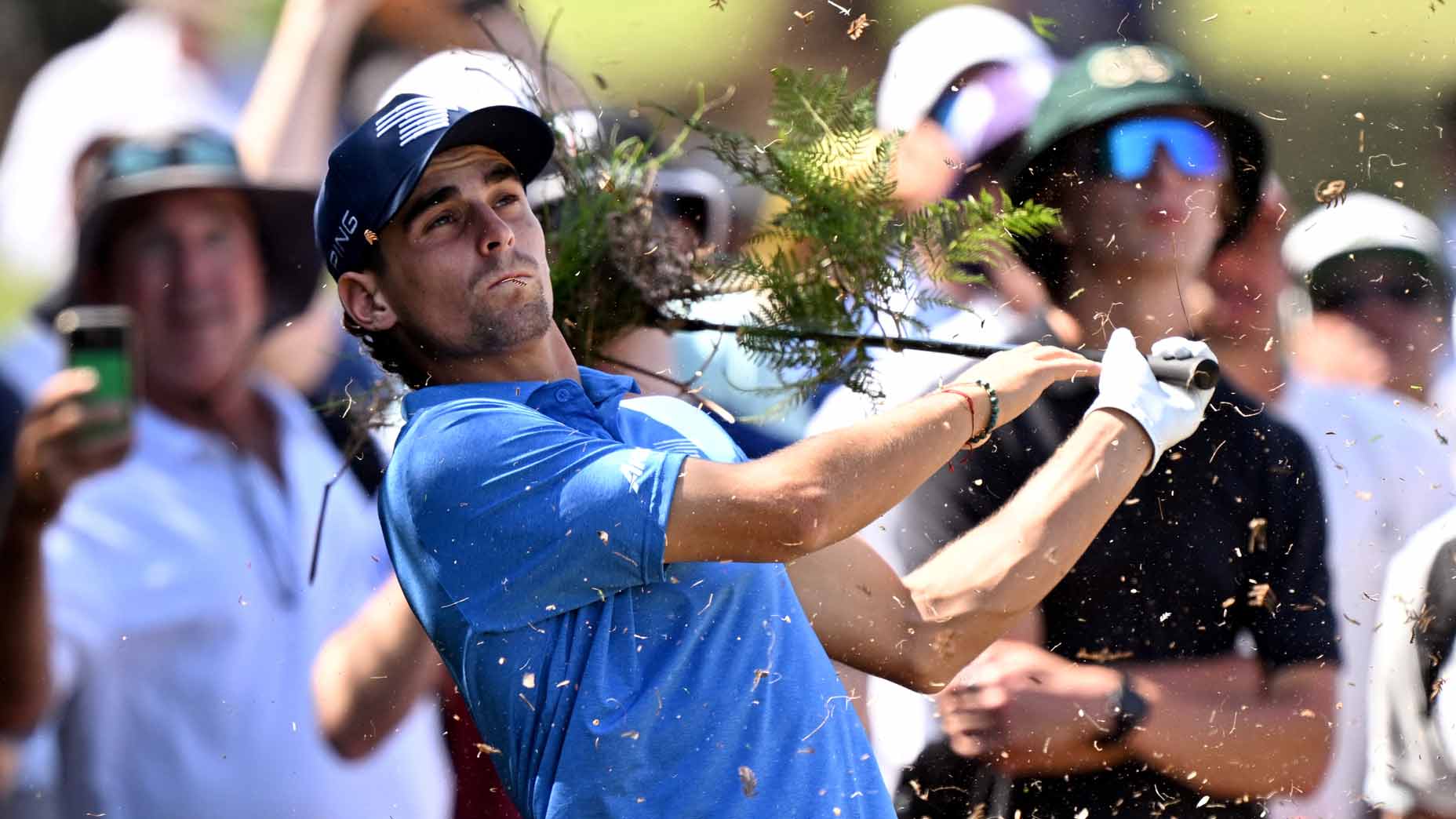 Pro golfer Joaquin Niemann hits out of the rough during the first round of the 2024 ISPS Handa Australian Open Golf tournament at the Kingston Heath Club.