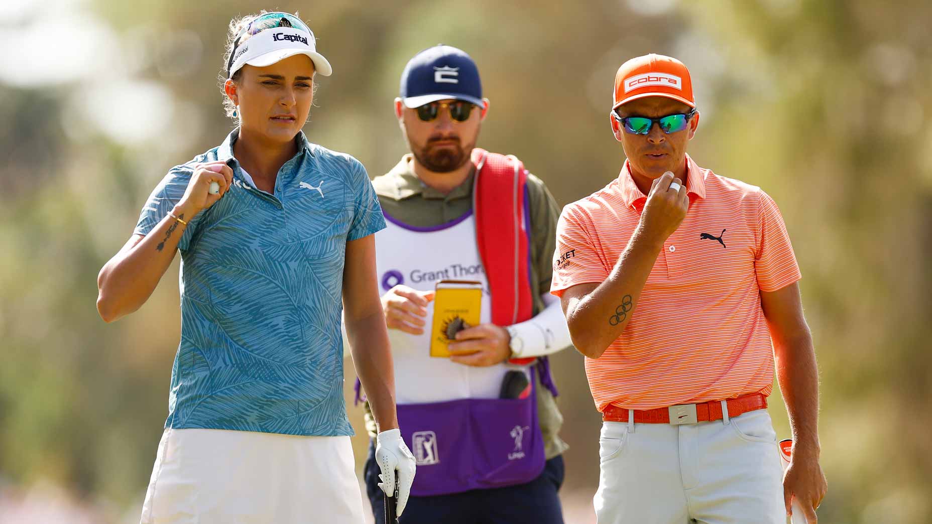 Rickie Fowler and Lexi Thompson on the second green during the final round of the 2023 Grant Thornton Invitational at Tiburon Golf Club.