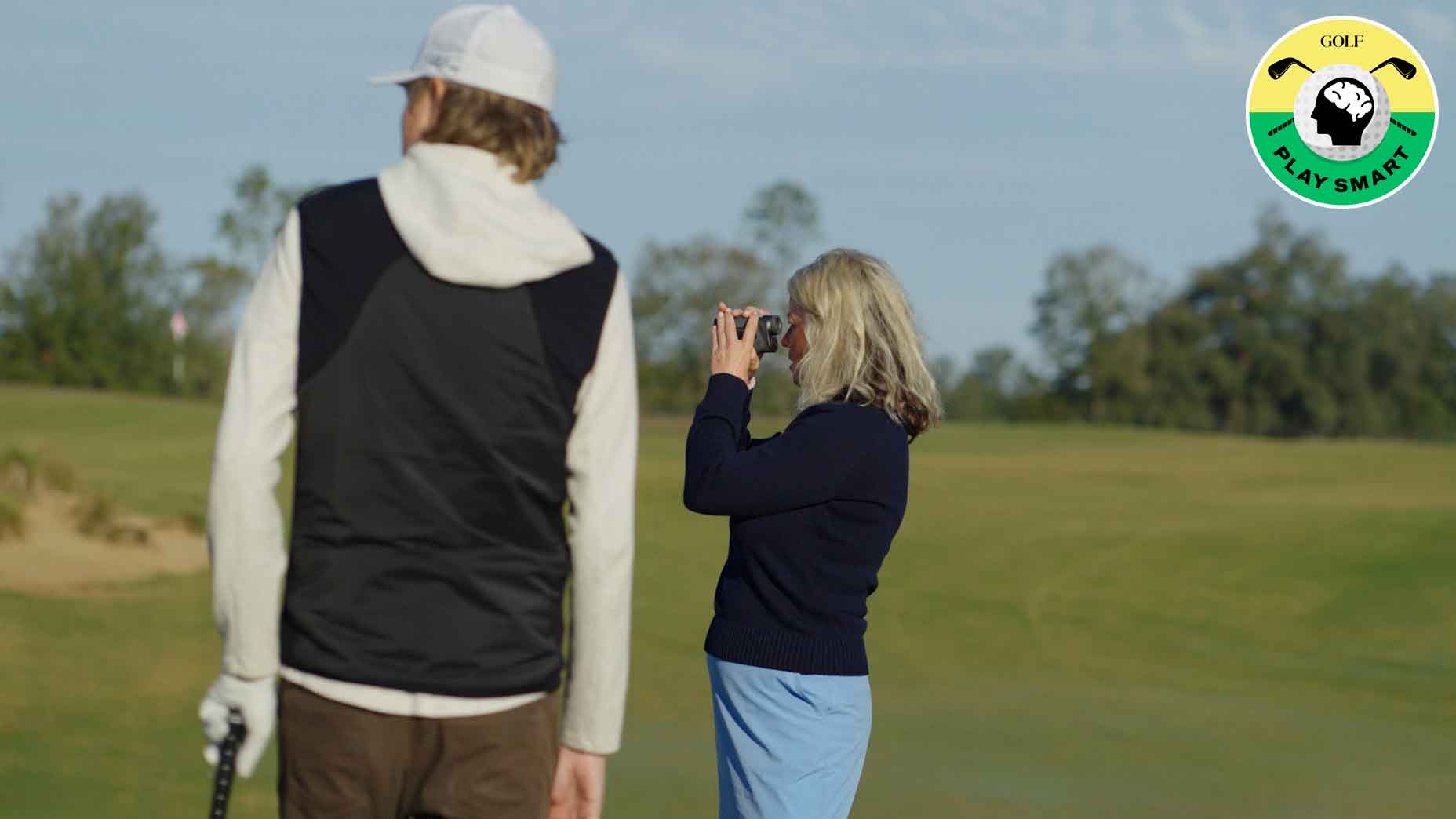 stef shaw uses rangefinder while zephyr melton looks on