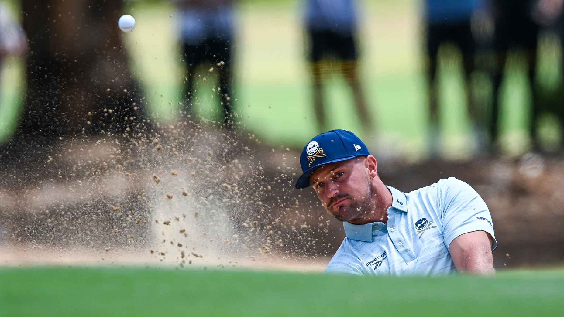 Bryson DeChambeau plays a bunker shot during LIV Adelaide.