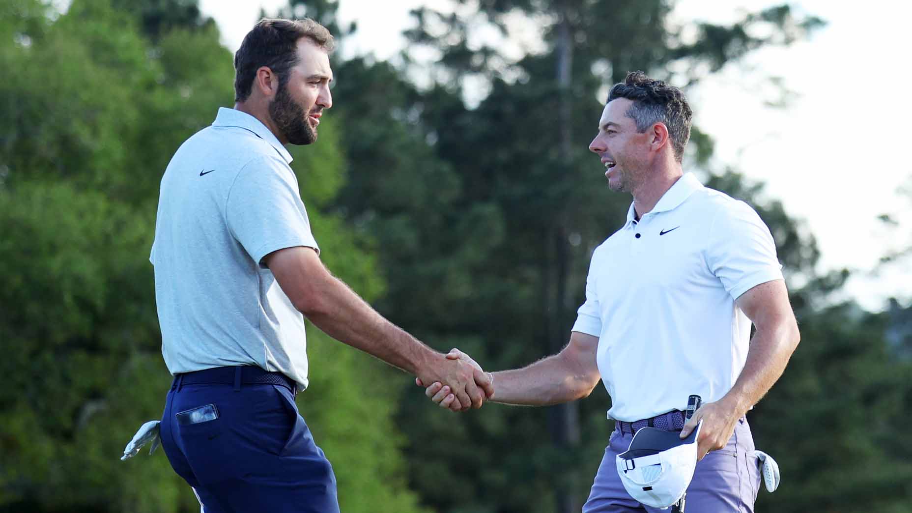 PGA Tour pros Scottie Scheffler and Rory McIlroy shake hands after the first round of the 2024 Masters.